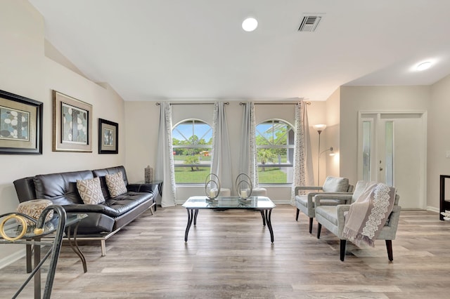 living room with light hardwood / wood-style flooring