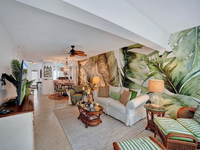 tiled living room with a textured ceiling and ceiling fan