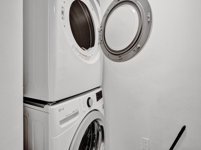 laundry area featuring laundry area and stacked washer / dryer