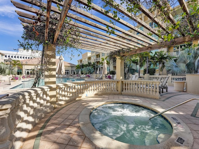 pool featuring a patio, a community hot tub, and a pergola