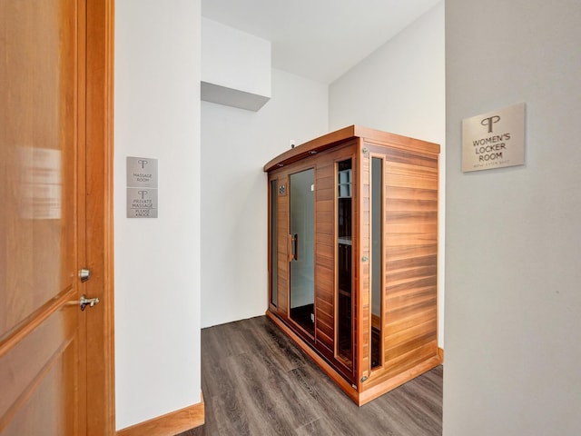 hallway featuring dark wood-style floors and a sauna