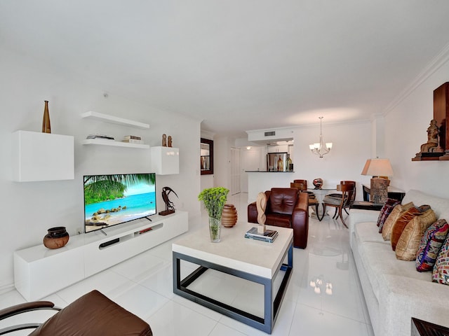 living area featuring a chandelier, light tile patterned floors, and ornamental molding