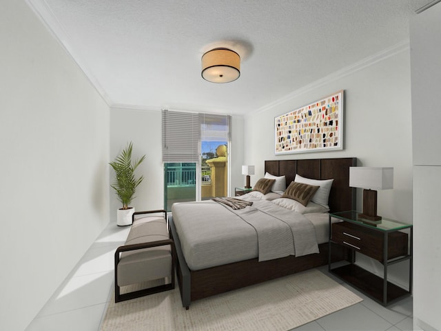 bedroom featuring tile patterned flooring, a textured ceiling, access to outside, and ornamental molding