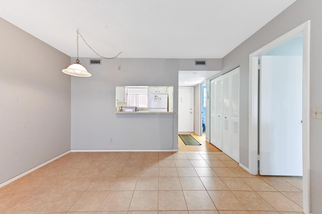 interior space with light tile patterned floors