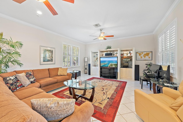 tiled living room with ceiling fan and crown molding