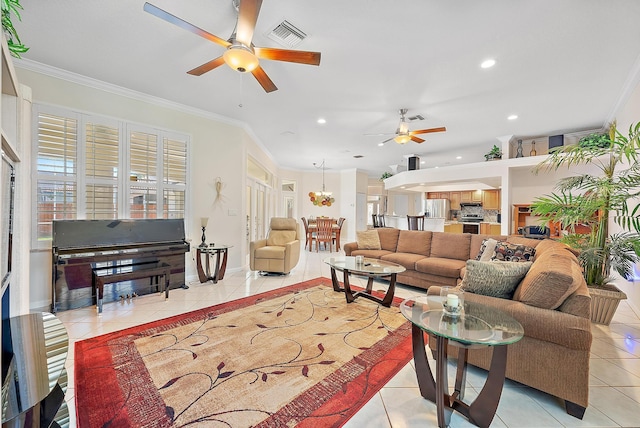 living room featuring crown molding, ceiling fan with notable chandelier, and light tile patterned floors