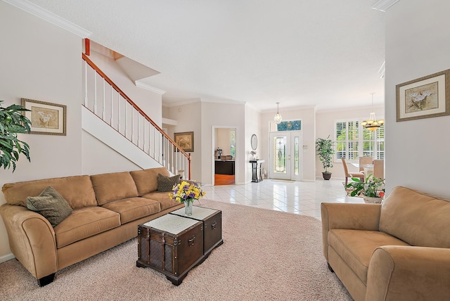 living room with a chandelier, ornamental molding, and light carpet