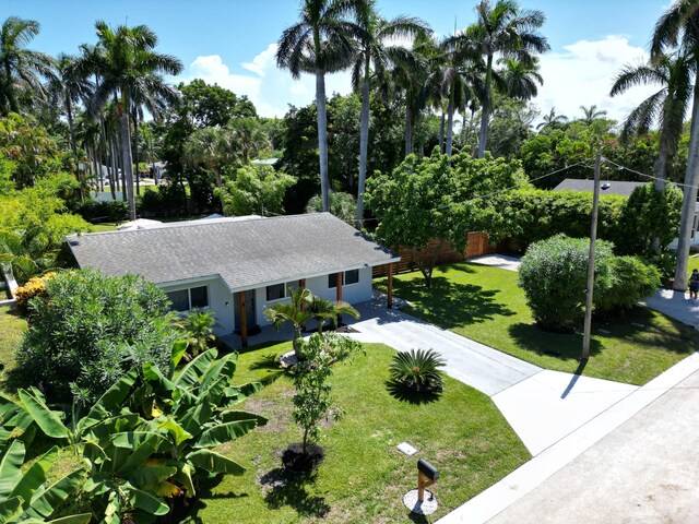 ranch-style house with a front lawn