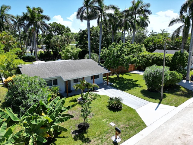 ranch-style house with a front lawn