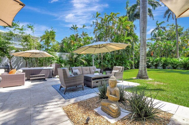 exterior space with a lawn, a patio area, and an outdoor hangout area