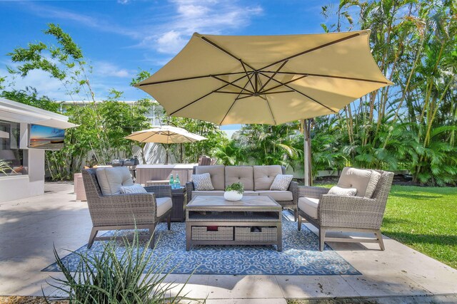 view of patio with a hot tub and grilling area