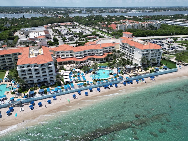 aerial view featuring a water view and a beach view