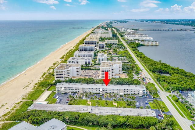 aerial view with a water view and a view of the beach