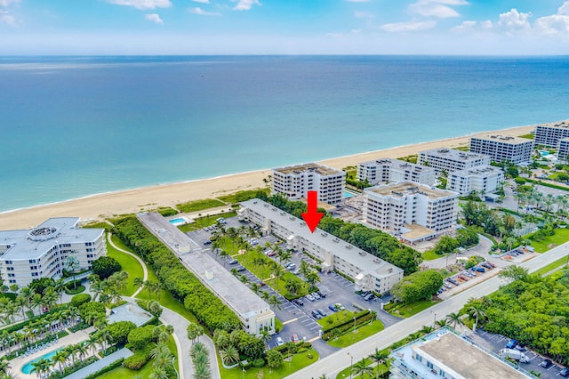 aerial view featuring a view of the beach and a water view