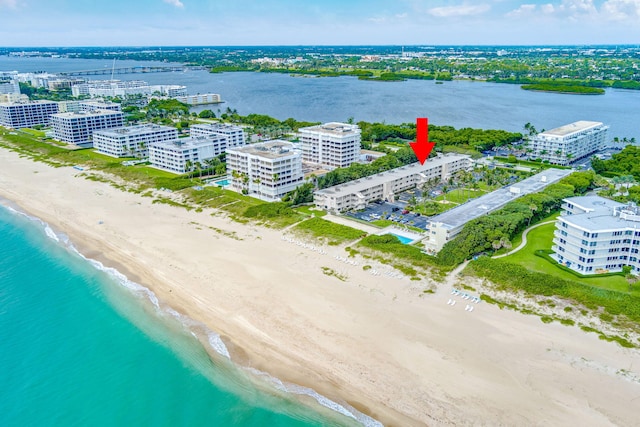 birds eye view of property featuring a water view and a view of the beach