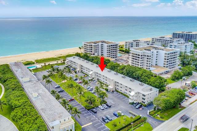 aerial view with a beach view and a water view