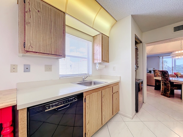 kitchen featuring sink, a chandelier, a textured ceiling, dishwasher, and light tile patterned floors