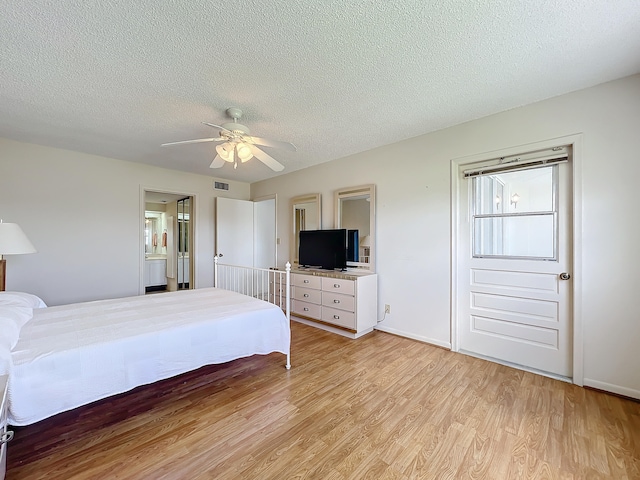 unfurnished bedroom with ceiling fan, light hardwood / wood-style flooring, and a textured ceiling