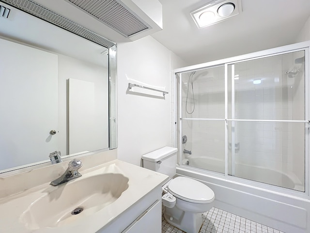 bathroom with visible vents, toilet, enclosed tub / shower combo, tile patterned flooring, and vanity