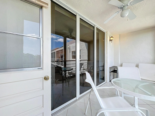 balcony featuring a ceiling fan