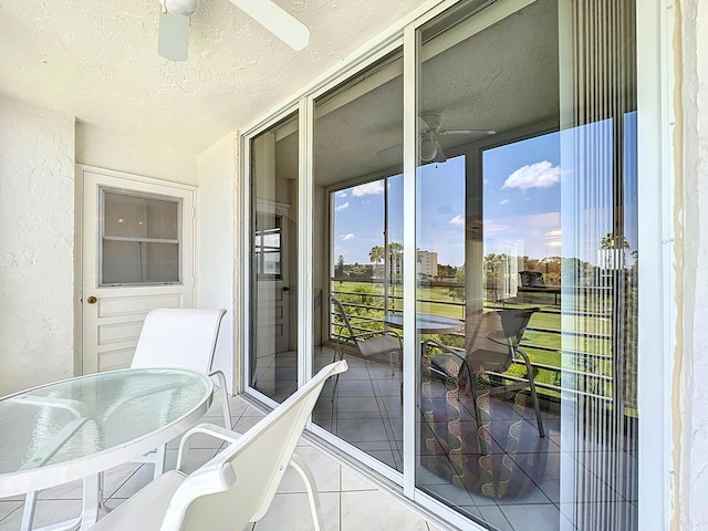 balcony featuring ceiling fan