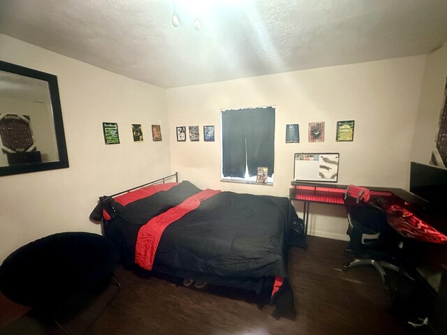 bedroom featuring hardwood / wood-style flooring