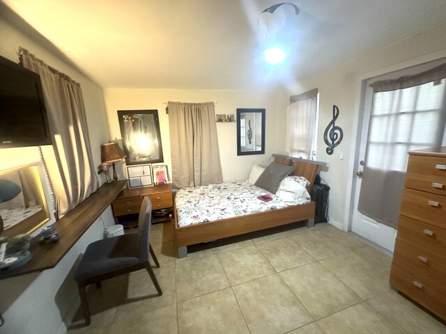 bedroom featuring light tile patterned flooring