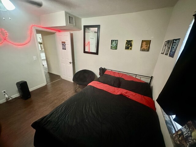 bedroom featuring hardwood / wood-style flooring and ceiling fan