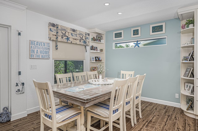 dining area with a textured ceiling, a healthy amount of sunlight, and dark wood-type flooring