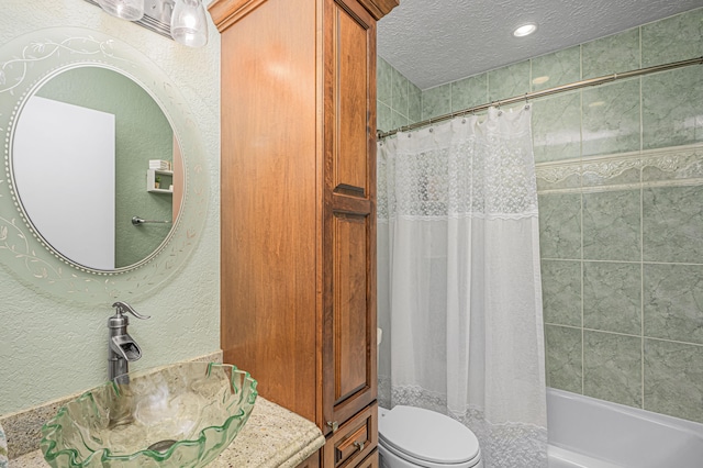 full bathroom with a textured ceiling, vanity, toilet, and shower / bathtub combination with curtain