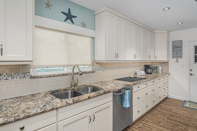 kitchen featuring hardwood / wood-style floors, tasteful backsplash, dishwasher, sink, and white cabinets