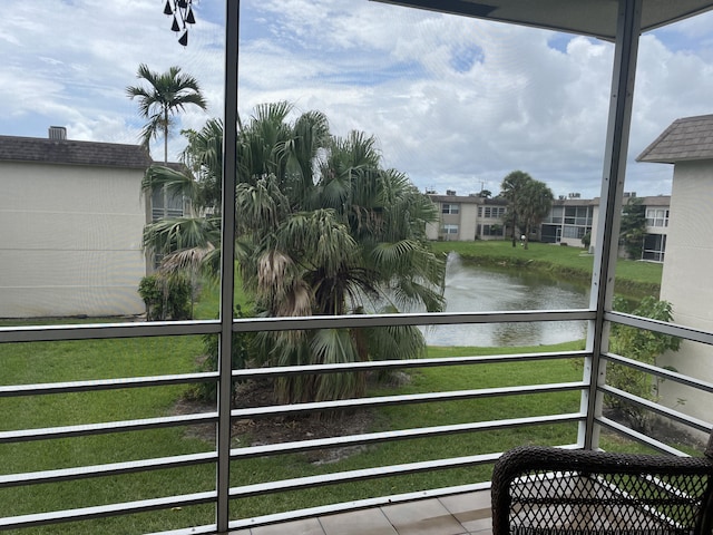 balcony featuring a water view