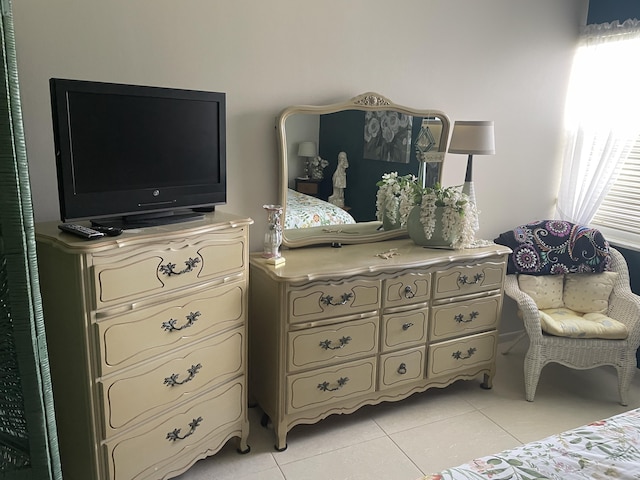 bedroom featuring light tile patterned floors