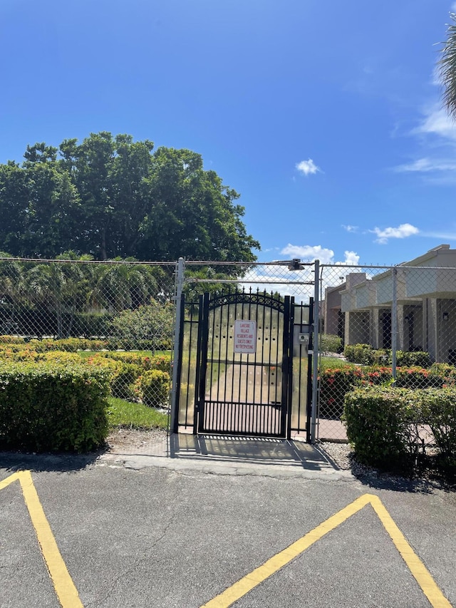 view of gate featuring fence