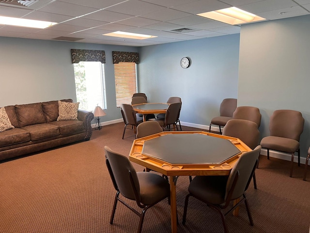 game room with carpet and a paneled ceiling