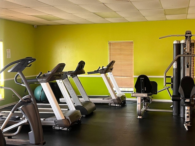 gym featuring a drop ceiling