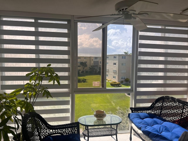 sunroom / solarium with ceiling fan