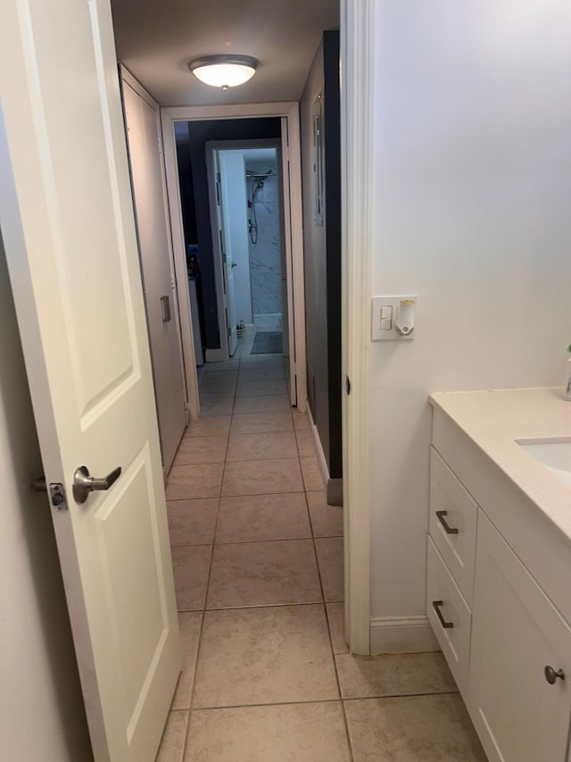 corridor featuring light tile patterned flooring