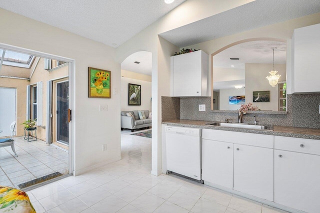 kitchen with sink, dishwasher, decorative backsplash, and white cabinetry