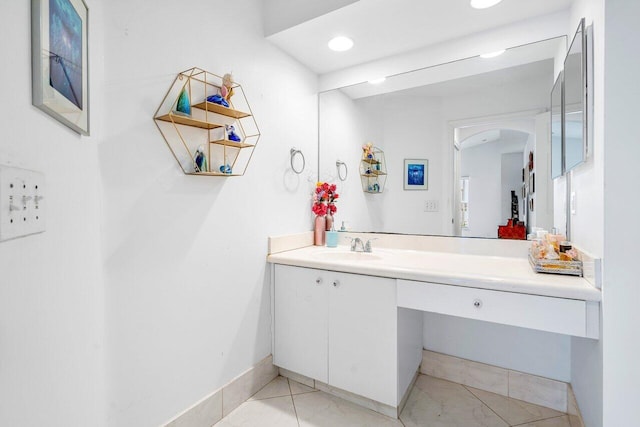 bathroom with tile patterned flooring and vanity