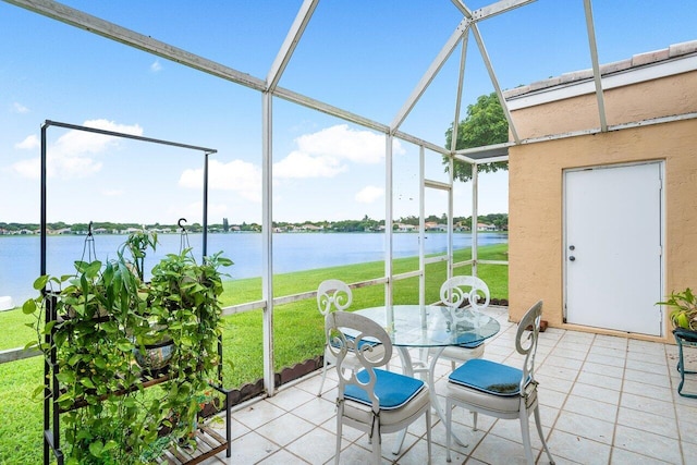 unfurnished sunroom with a water view