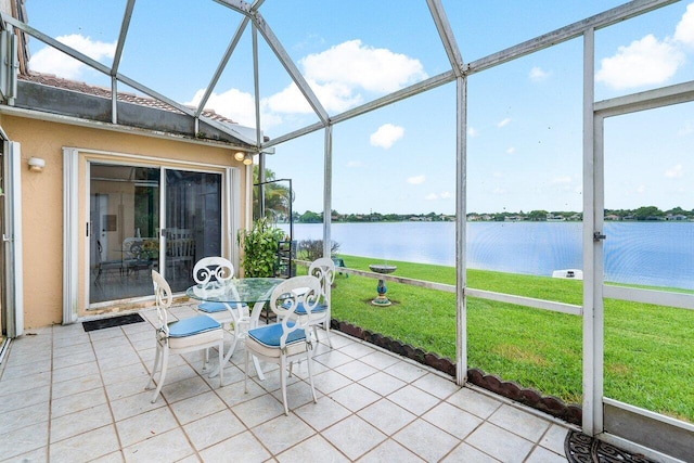 unfurnished sunroom with a water view