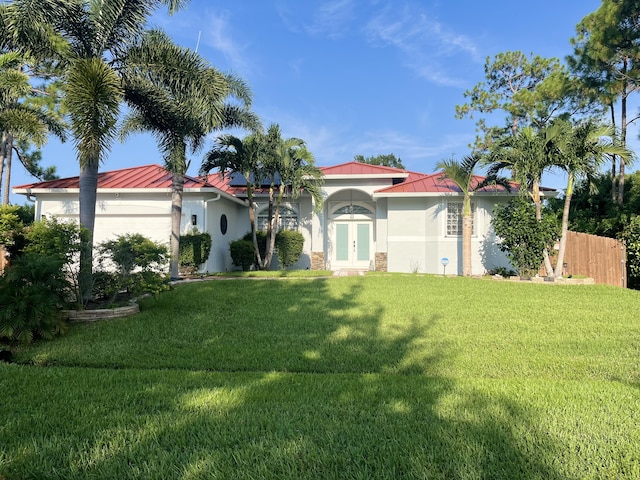 mediterranean / spanish-style house featuring a front yard