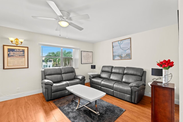 living room featuring hardwood / wood-style flooring and ceiling fan