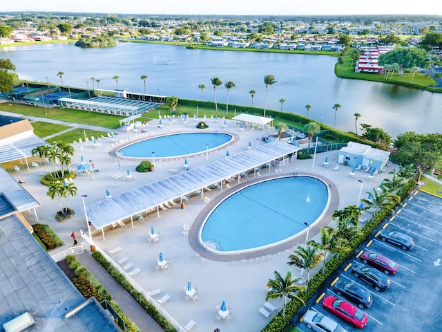 birds eye view of property featuring a water view