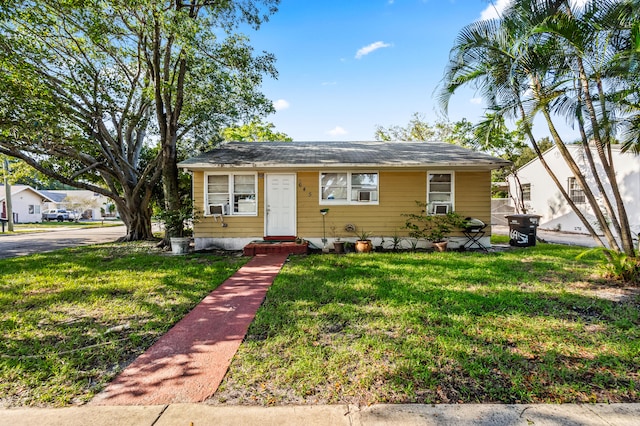 view of front of home with a front lawn