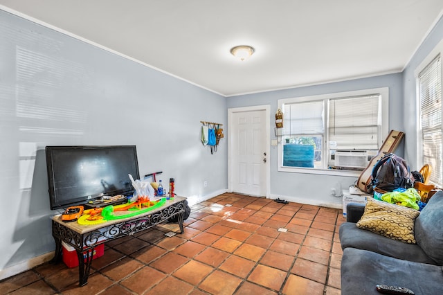 living room featuring a wealth of natural light, tile patterned flooring, and ornamental molding