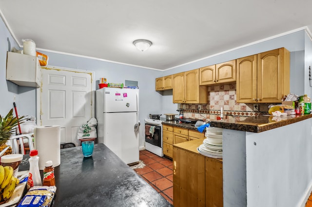 kitchen with backsplash, light tile patterned flooring, and white appliances