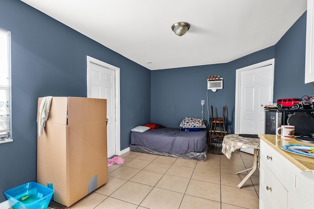 bedroom with light tile patterned floors