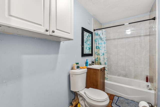 full bathroom with shower / tub combo with curtain, toilet, and vanity